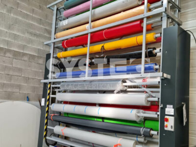Colorful rolls and bobbins in vertical storage